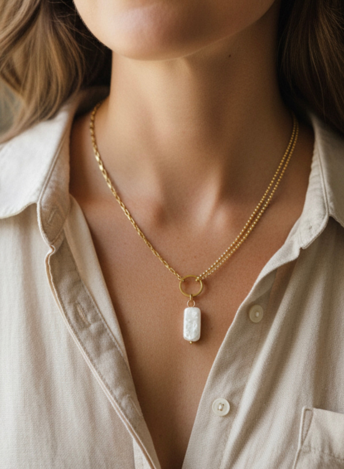 Imitation baroque pearl charm18k
golden ss necklace