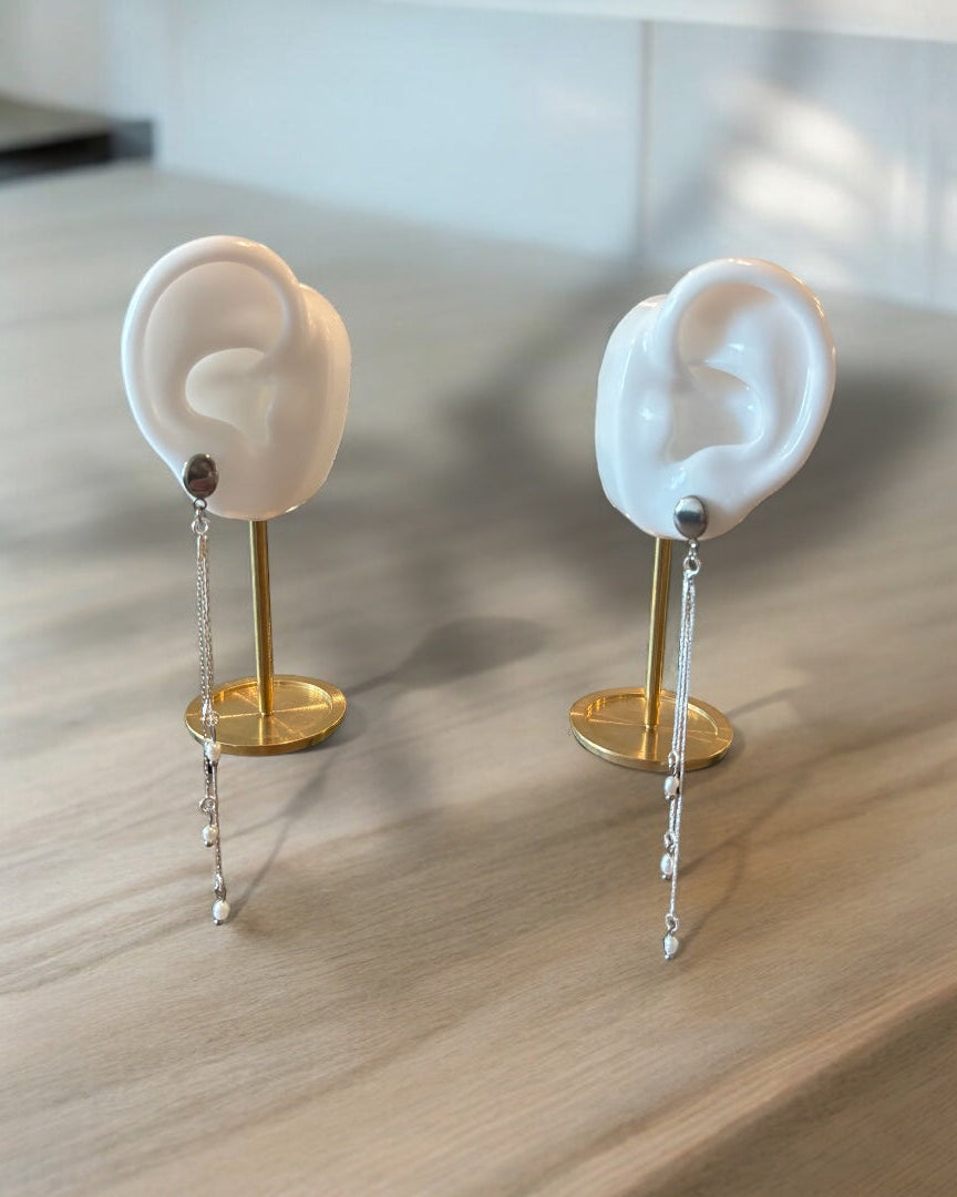 A falling earring silver long