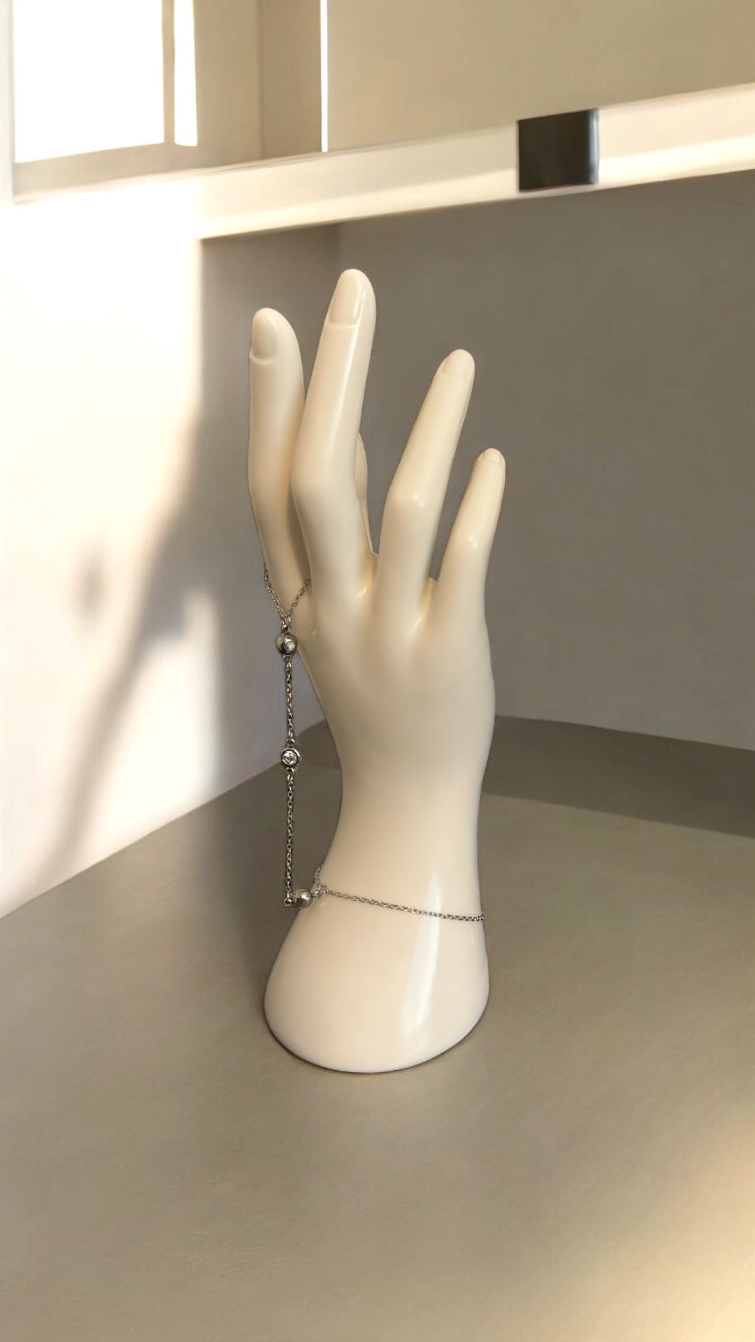 A bracelet with a ring attached