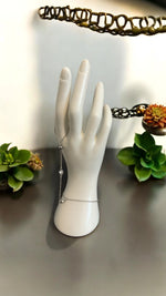 Load image into Gallery viewer, a bracelet with a ring attached
