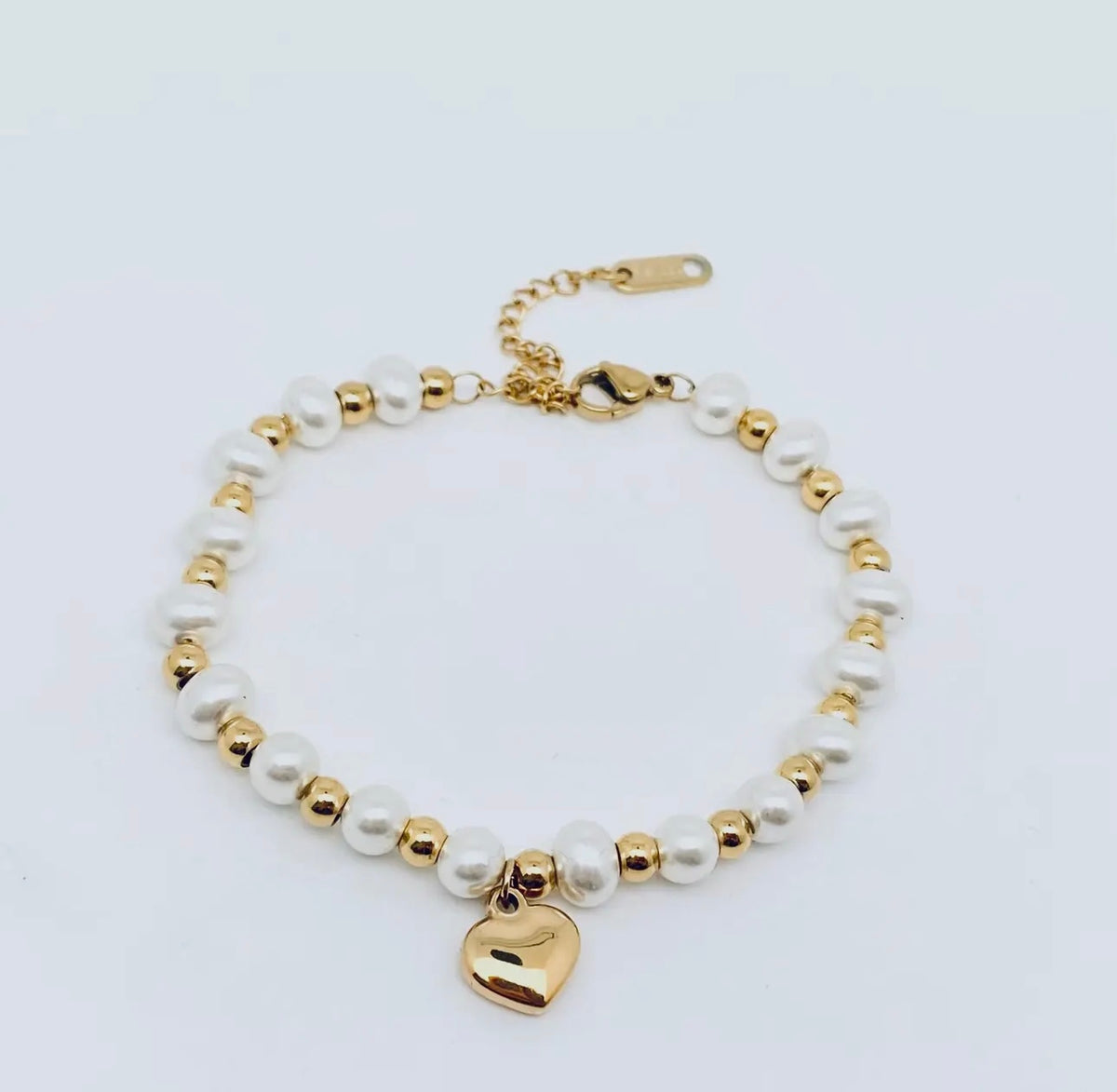 Stainless steel heart pendant pearl
beaded bracelet