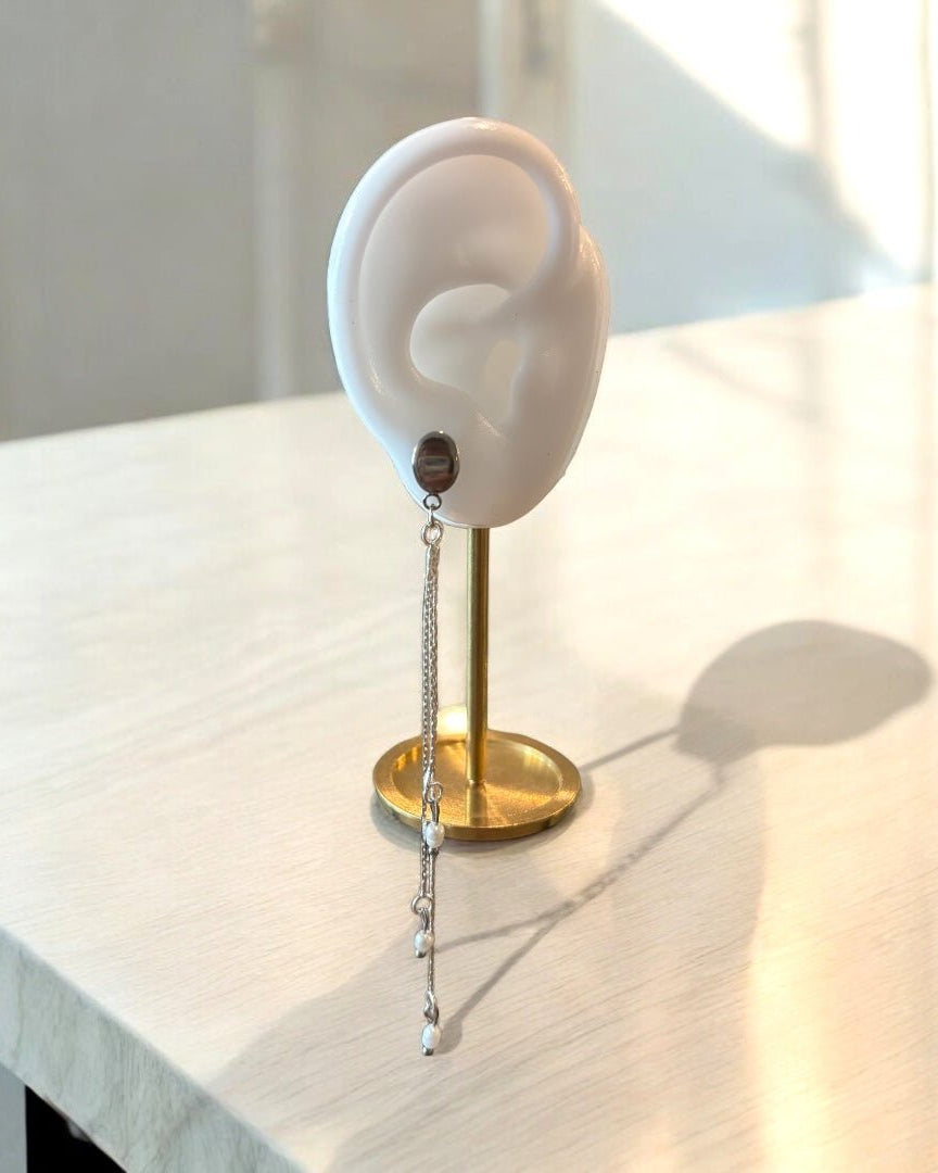 A falling earring silver long