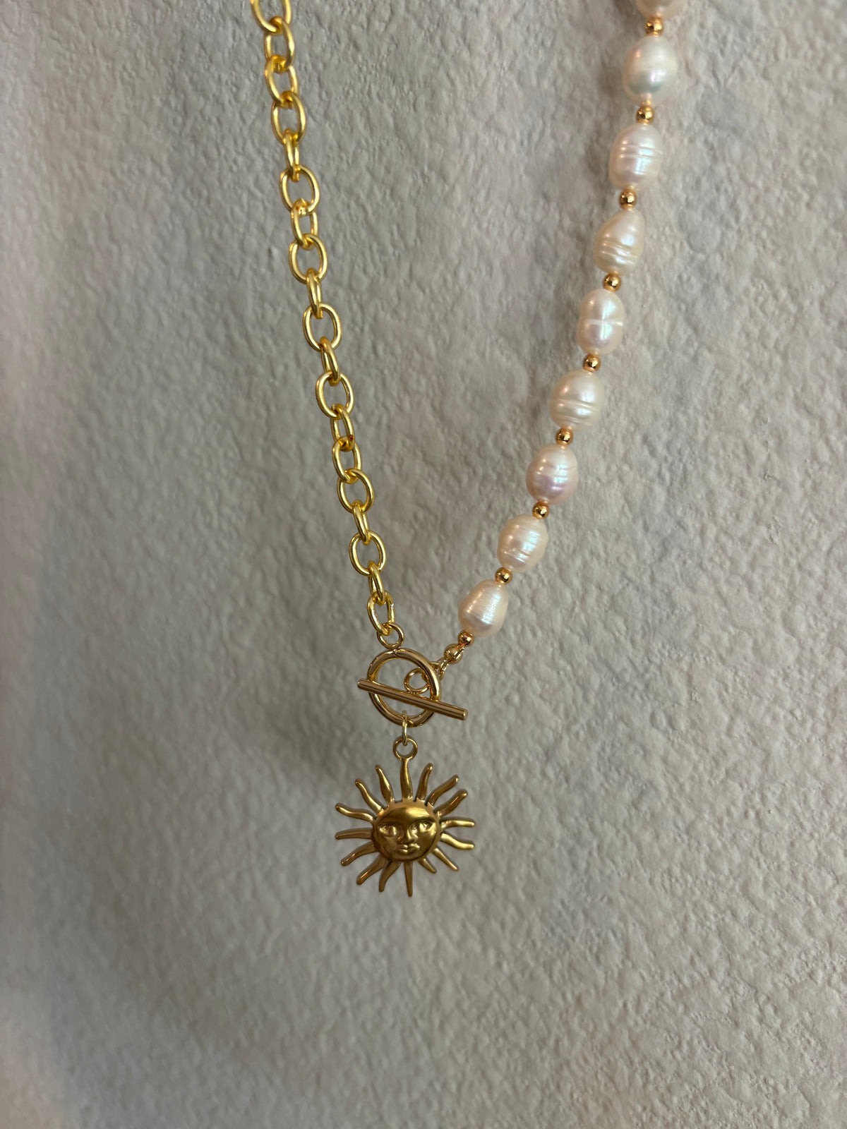 ￼ half big chain half pearls, with sun pendant
